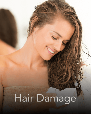 A lady with open hair after shower smiling. Thumbnail for Hair Damage.