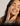 A lady touching her cheeks and smiling