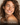 A lady with dry skin smiling.