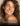 A lady with dry skin smiling.